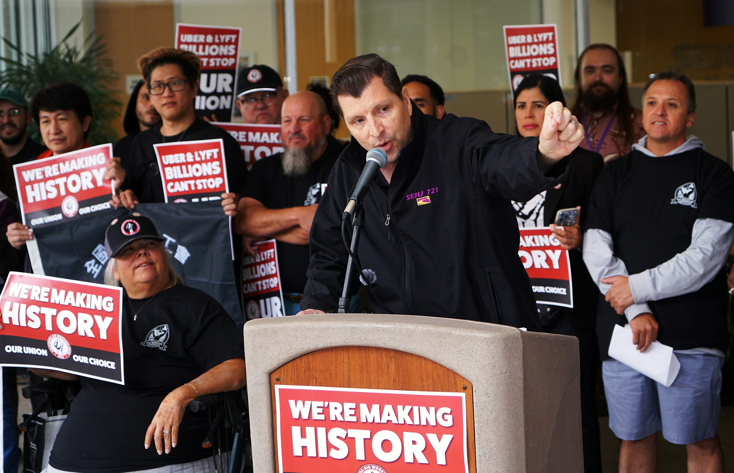 Driver speaking at the We're Making History podium