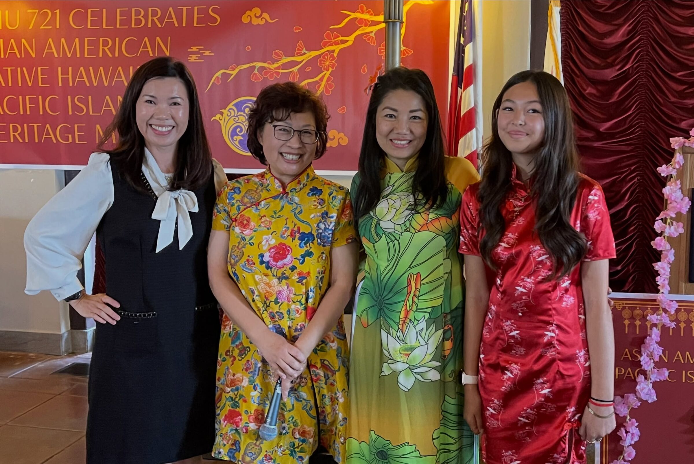 Four AANHPI women in cultural dress at SEIU 721's AANHPI heritage celebration