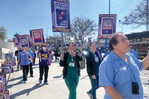 Union members march on Marengo St. outside the LA General Medical Center in Boyle Heights.
