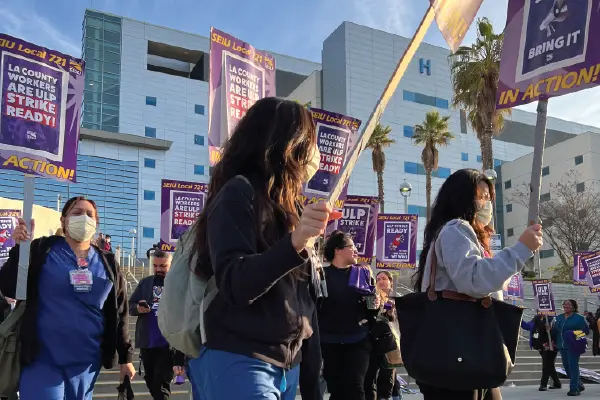 Nurses and other medical staff march outside the LA General Medical Center in Boyle Heights.