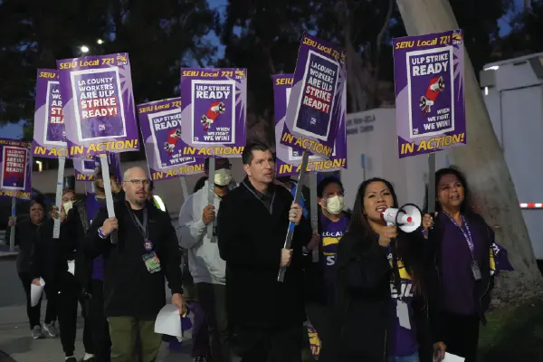 Union workers and SEIU 721 President David Green march outside the Olive View-UCLA Medical Center in Sylmar.