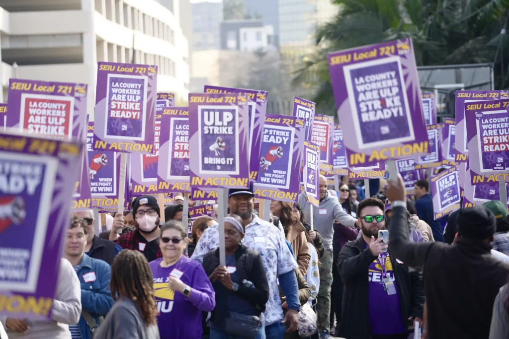 LA County union members hold picket signs.