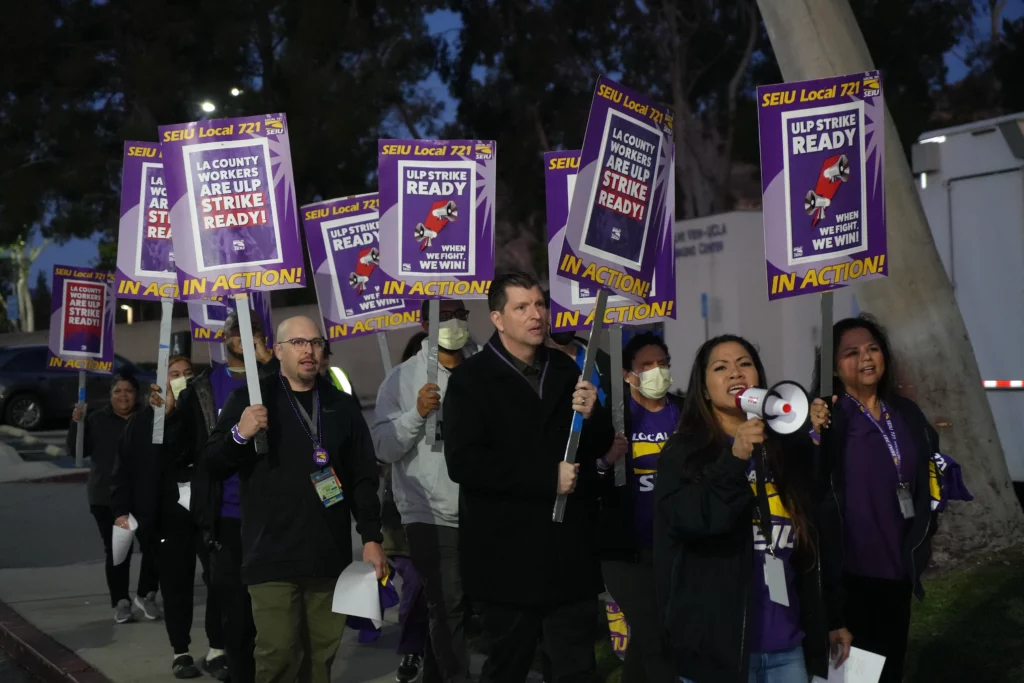 SEIU 721 President David Green marches with union members outside the Olive View-UCLA Medical Center in Sylmar, CA.