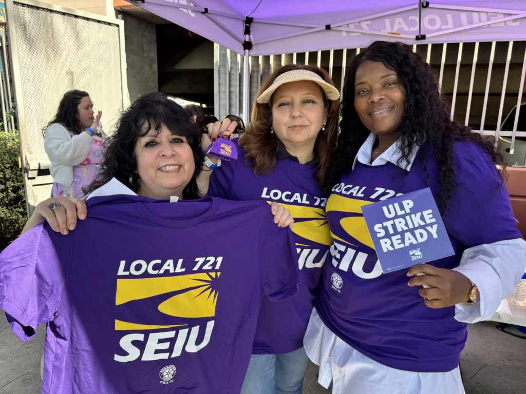 Three union members display their union pride.