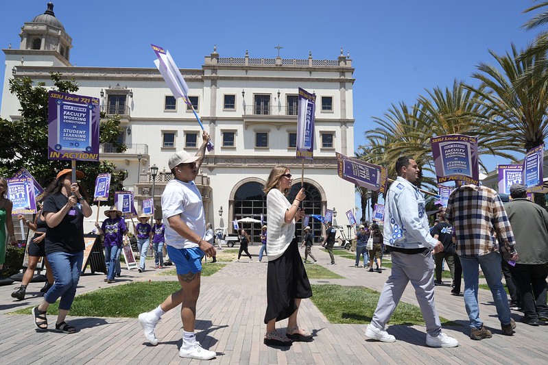 USD NTT Faculty union members and supporters marching with picket signs