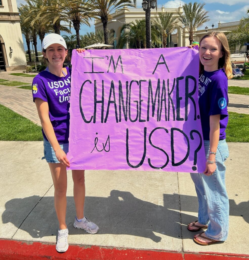 USD students holding a sign reading "I'm a changemaker is USD?"