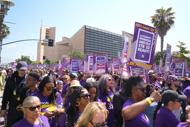 Striking LA County workers march down Temple St. in downtown LA's Civic Center.